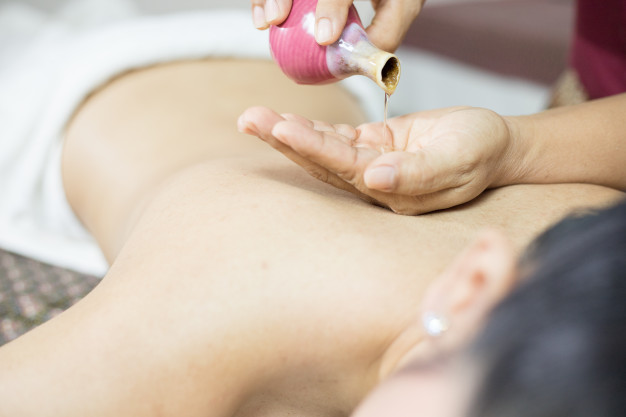 asian woman getting thai herbal compress massage spa 59462 94 1