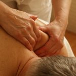 Close-up of a therapist giving a relaxing shoulder massage, enhancing wellness and stress relief.