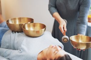 woman,having,a,tibetan,sound,bowl,massage
