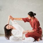 masseuse,making,thai,yoga,massage.,woman,therapist,doing,traditional,massage